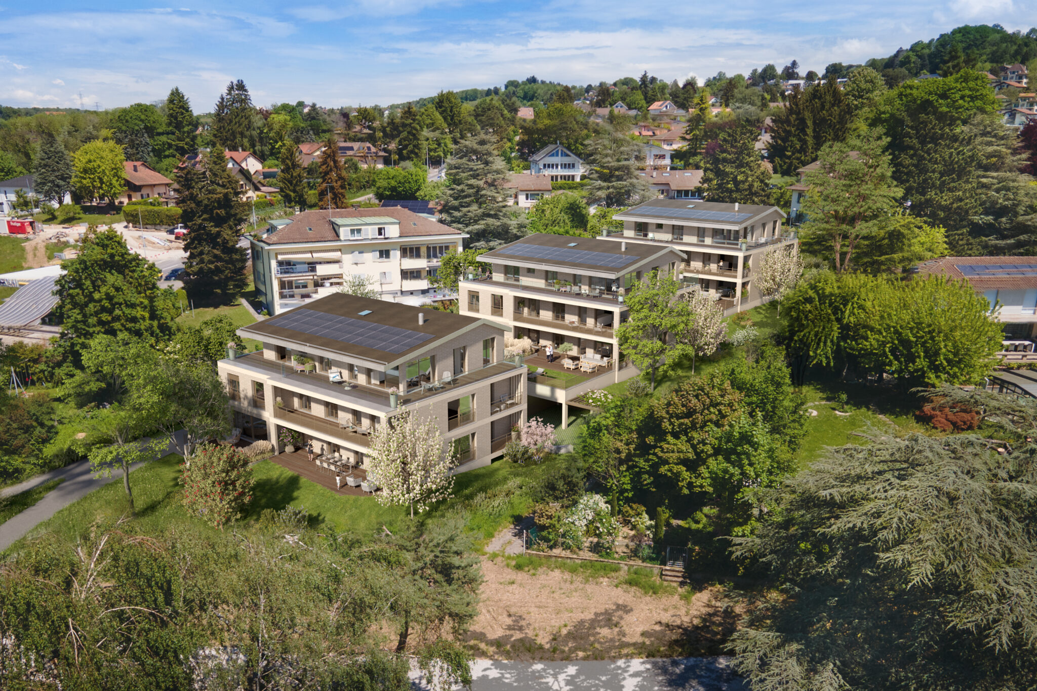 Champs d'Aullie au Mont-sur-Lausanne, vue aérienne des trois bâtiments de douze appartements